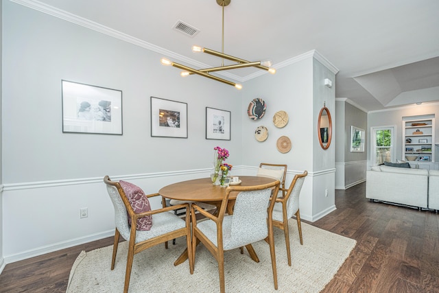 dining room with a chandelier, dark hardwood / wood-style flooring, and crown molding