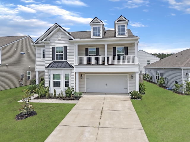 view of front of home with a front yard, a garage, driveway, roof with shingles, and a standing seam roof