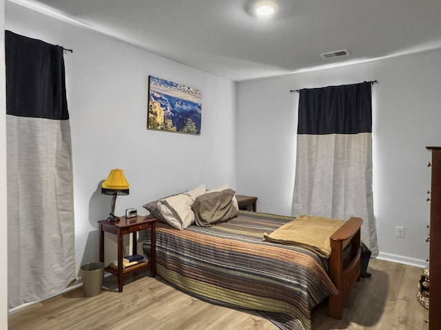 bedroom featuring wood finished floors