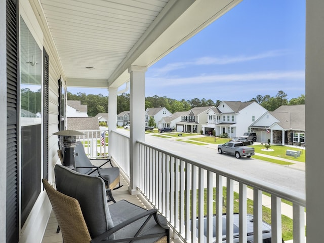 balcony featuring a residential view and a porch