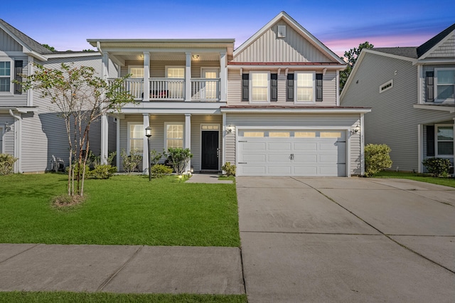 view of front of property with a garage and a lawn