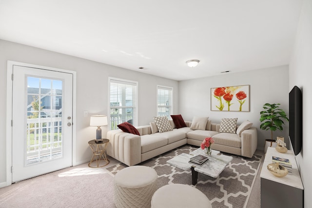 living room with carpet flooring and a healthy amount of sunlight