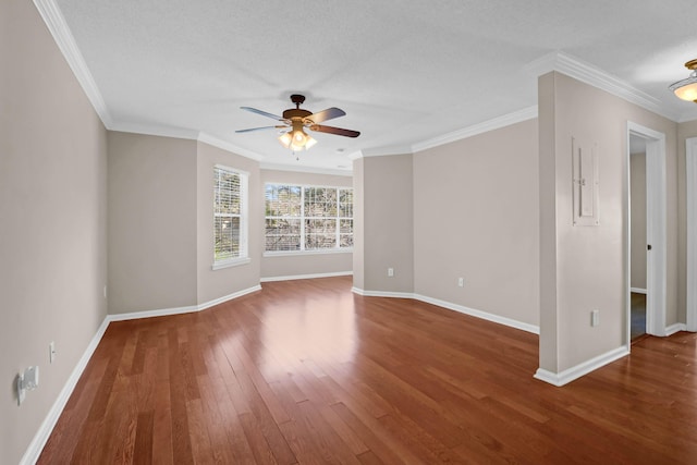 spare room with ceiling fan, crown molding, wood-type flooring, and a textured ceiling