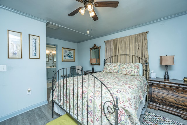 bedroom featuring ensuite bathroom, ceiling fan, ornamental molding, and hardwood / wood-style flooring