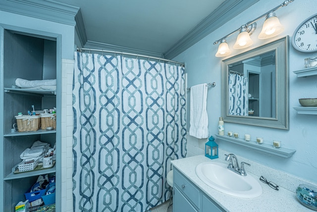 bathroom with walk in shower, vanity, and ornamental molding