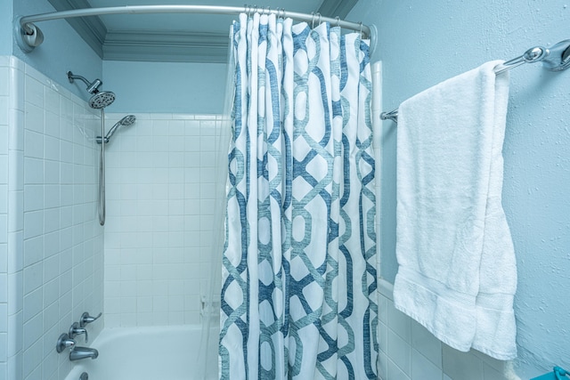 bathroom featuring shower / bathtub combination with curtain and ornamental molding