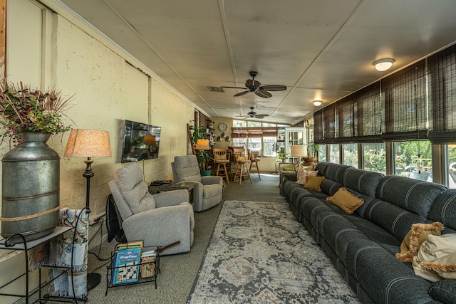 living room with ceiling fan and lofted ceiling