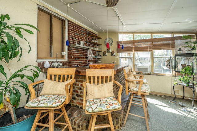 sunroom featuring lofted ceiling