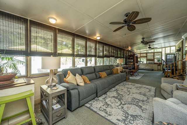 living room featuring carpet, ceiling fan, and vaulted ceiling