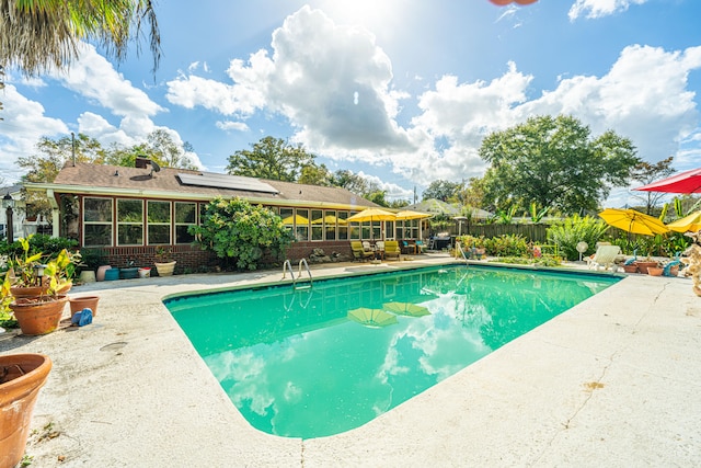 view of swimming pool featuring a patio