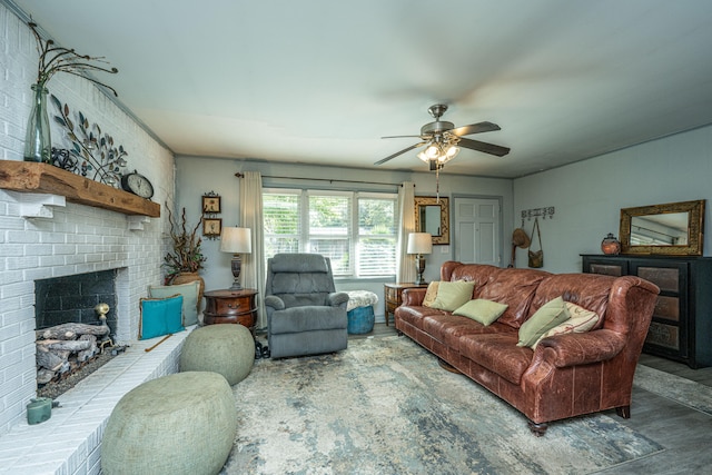 living room featuring ceiling fan and a brick fireplace