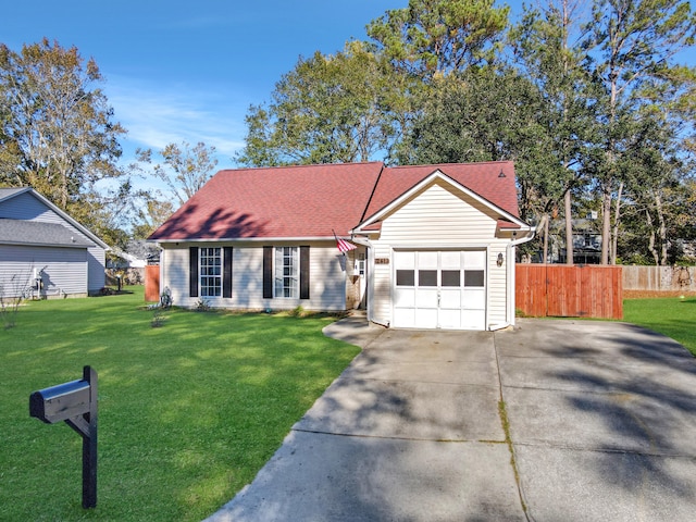 ranch-style house featuring a garage and a front lawn