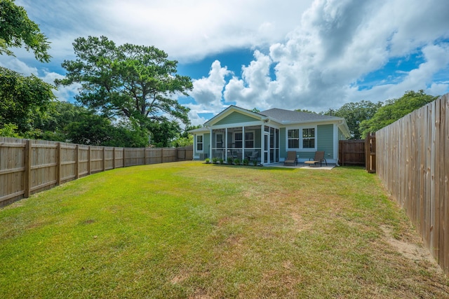 4319 Bream Rd, Charleston, SC 29418 - back of house with a sunroom, a patio, and a fenced backyard