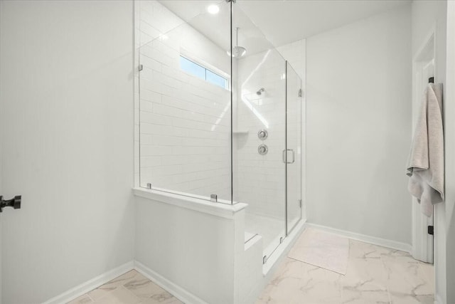 bathroom with a shower with shower door