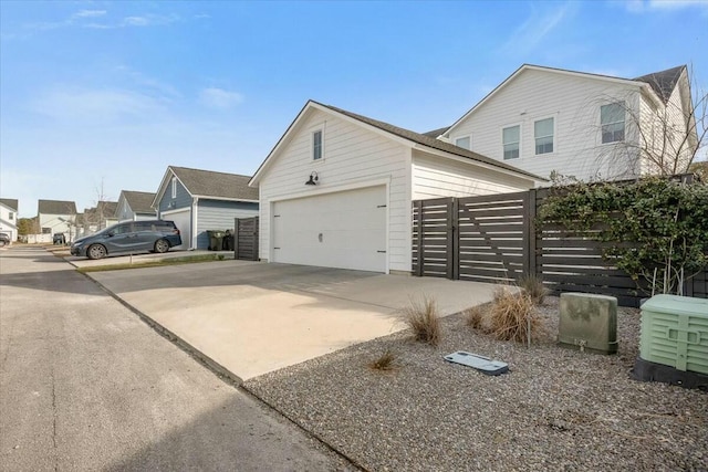 view of side of home with an outdoor structure and a garage