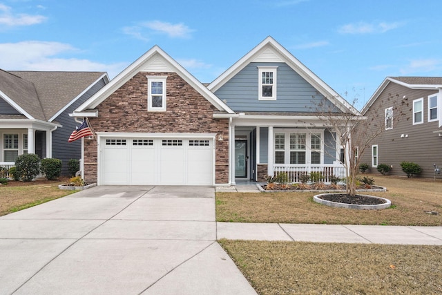 craftsman inspired home featuring driveway, a garage, covered porch, and stone siding