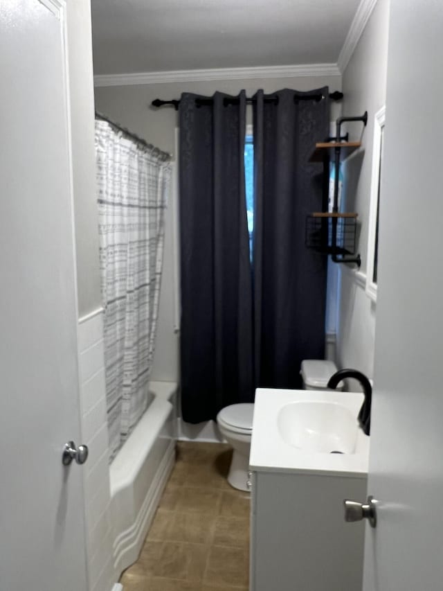 full bathroom featuring tile patterned flooring, toilet, vanity, ornamental molding, and shower / bath combo with shower curtain