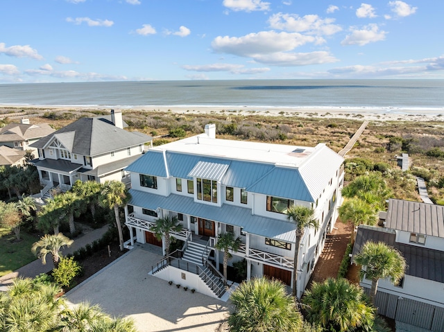 aerial view with a beach view and a water view