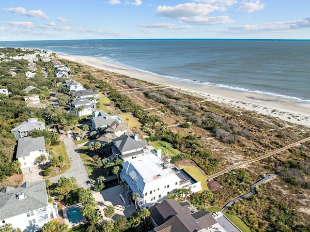 aerial view with a water view and a beach view