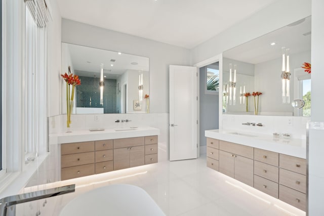 bathroom featuring tile patterned floors, vanity, and a wealth of natural light