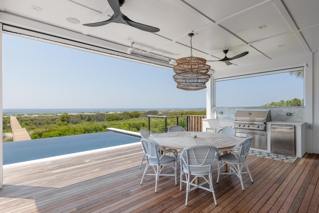 wooden deck featuring area for grilling and sink