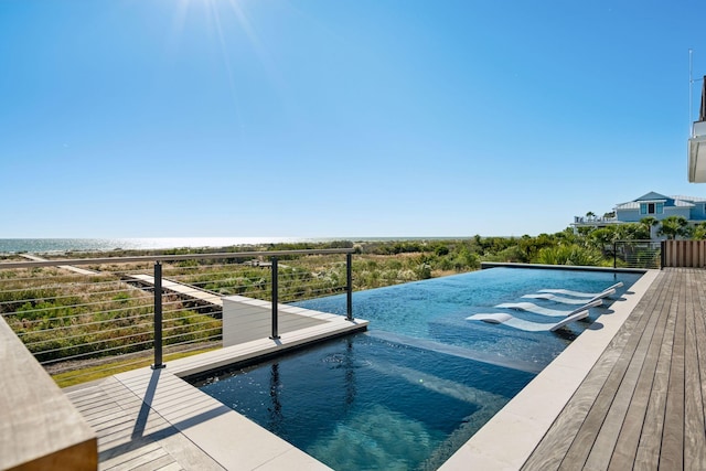 view of pool featuring a water view