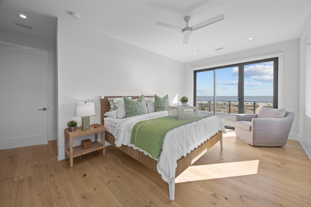 bedroom featuring ceiling fan and light hardwood / wood-style flooring