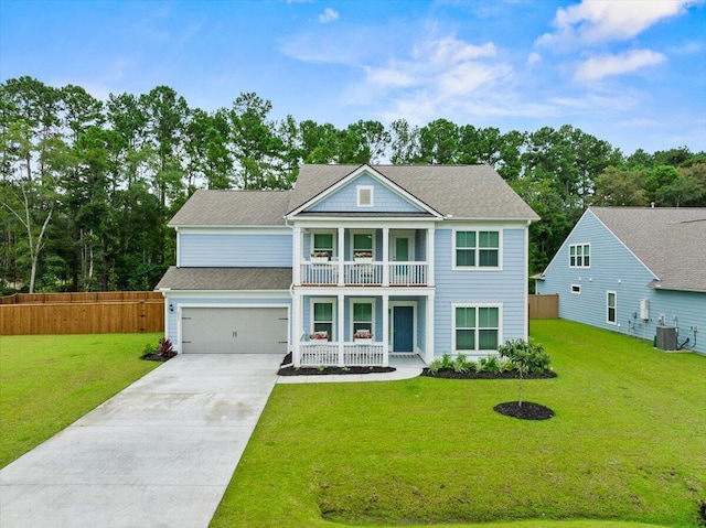 view of front facade with a balcony, an attached garage, covered porch, fence, and a front yard