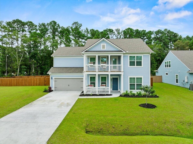 view of front facade with concrete driveway, fence, a balcony, a garage, and a front lawn