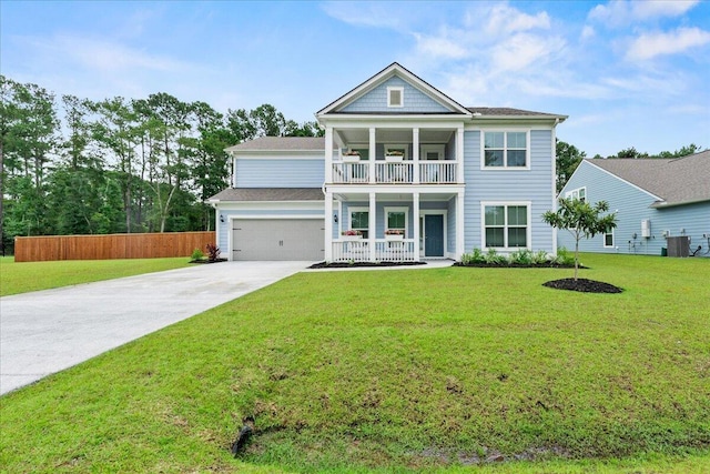 view of front of property featuring a garage, central AC unit, concrete driveway, a balcony, and a front yard