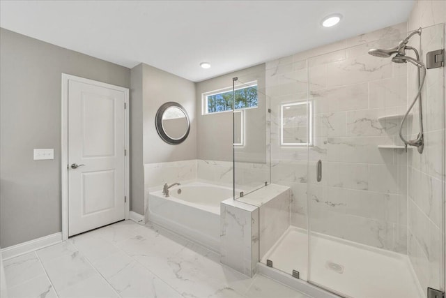 full bathroom featuring marble finish floor, a garden tub, recessed lighting, a shower stall, and baseboards