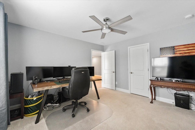 office area featuring a ceiling fan, carpet flooring, and baseboards