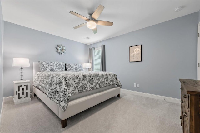 bedroom featuring ceiling fan, carpet flooring, visible vents, and baseboards