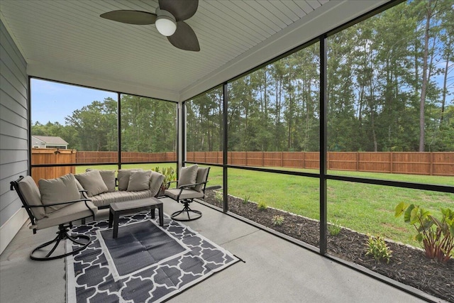 unfurnished sunroom with a ceiling fan