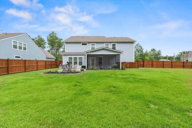 rear view of house featuring a yard, a patio, a fenced backyard, and a sunroom