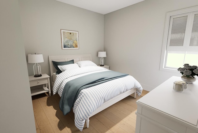 bedroom with baseboards and light wood-style floors