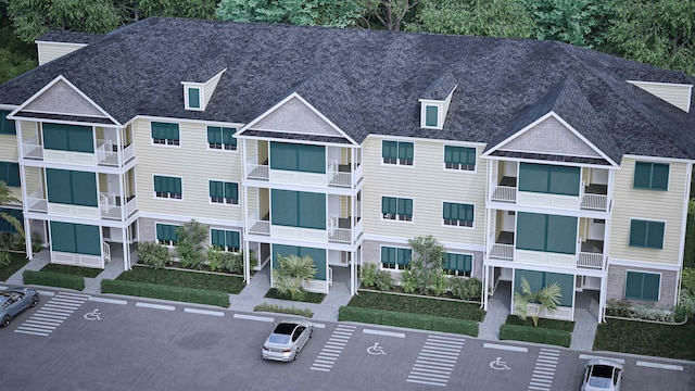view of building exterior with uncovered parking