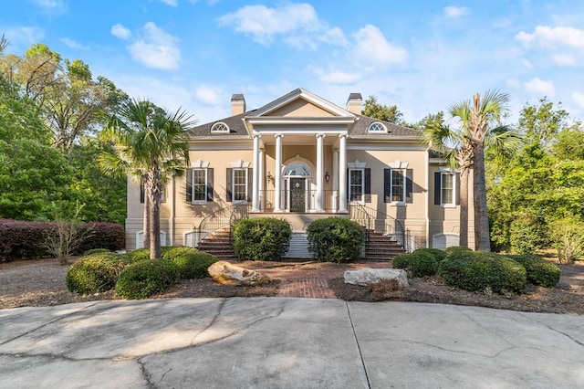 greek revival inspired property with covered porch