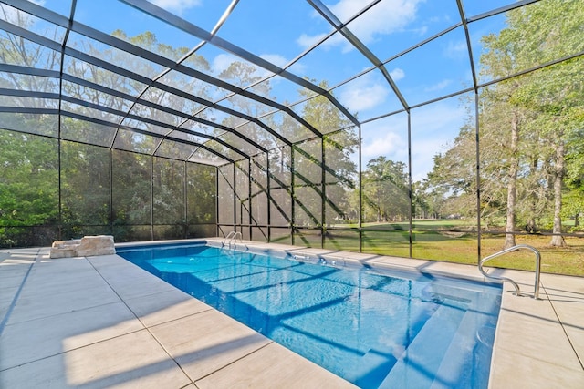 view of pool with a lanai and a patio area