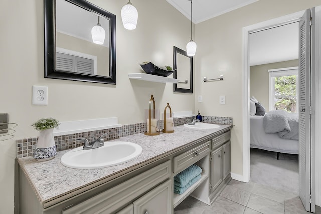 ensuite bathroom featuring double vanity, a sink, backsplash, and ensuite bath