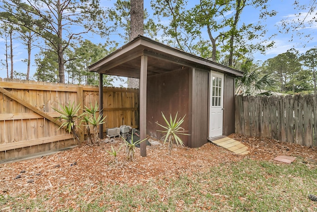 view of shed featuring a fenced backyard