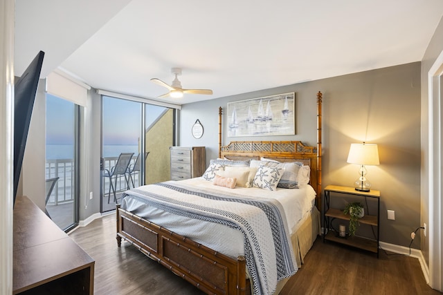 bedroom featuring a water view, dark wood-type flooring, access to exterior, and ceiling fan