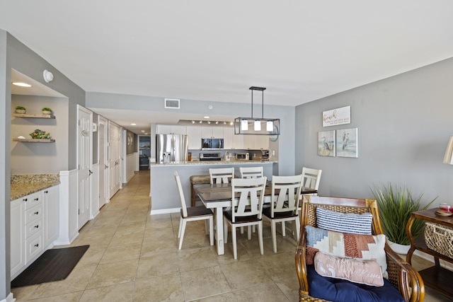 dining space with light tile patterned floors