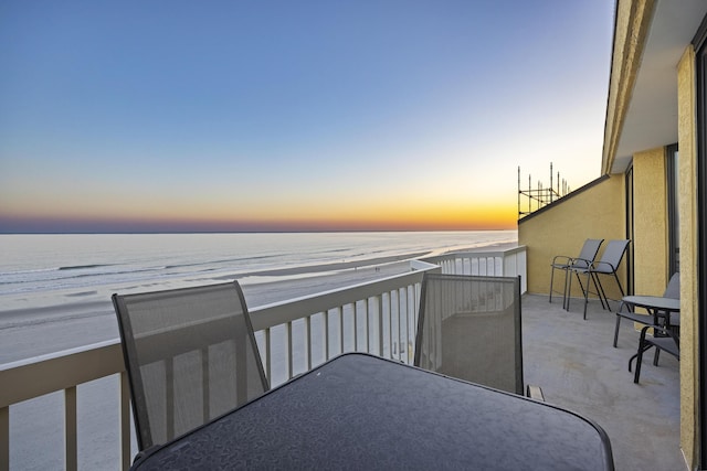 balcony at dusk with a water view