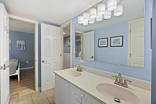 bathroom with vanity and tile patterned flooring