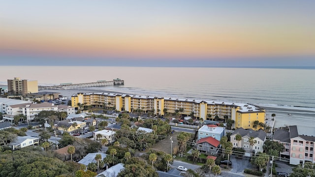 aerial view at dusk with a water view