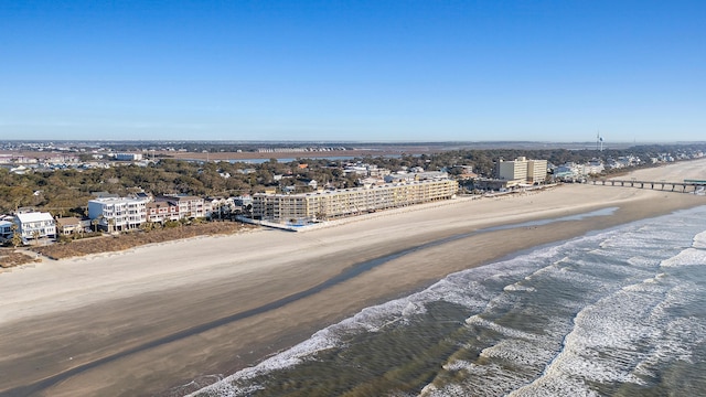 bird's eye view featuring a water view and a beach view