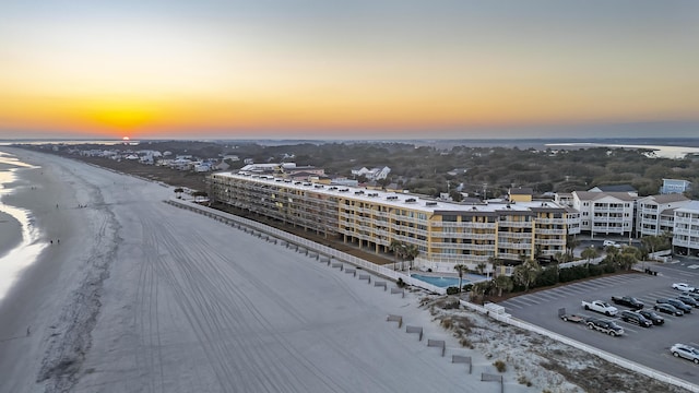 aerial view at dusk with a water view