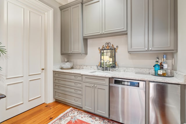 174 N Shelmore Blvd, Mount Pleasant, SC 29464 - kitchen with dishwasher, a sink, gray cabinetry, fridge, and light wood-style flooring