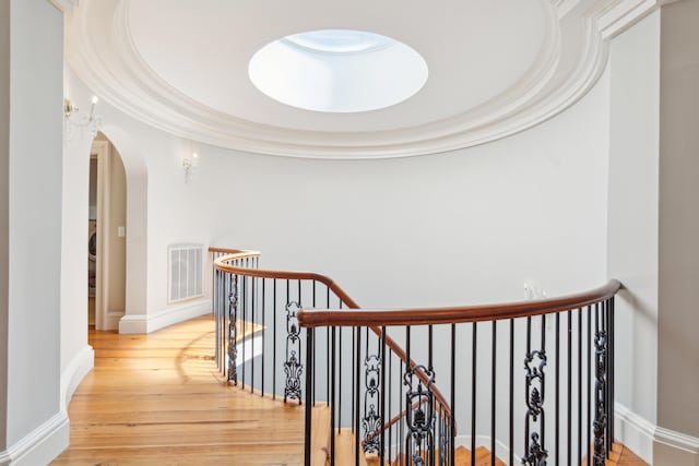 174 N Shelmore Blvd, Mount Pleasant, SC 29464 - hall featuring an upstairs landing, arched walkways, wood finished floors, and baseboards